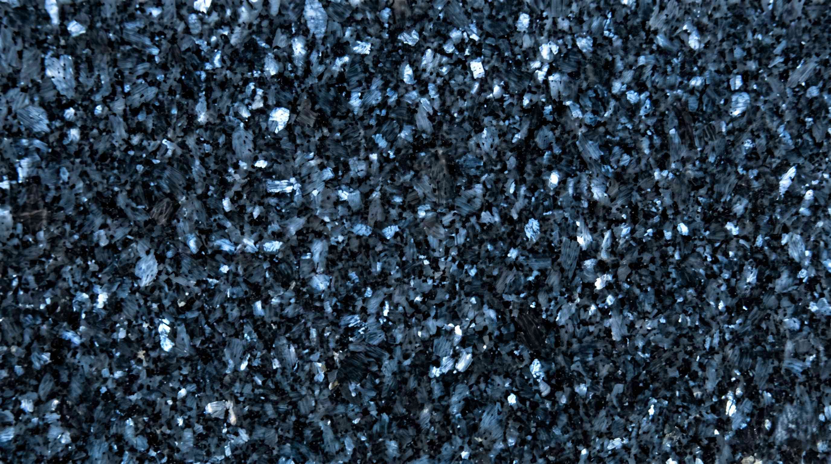 Premium Blue Pearl Indian Granite featuring breathtaking iridescent blue and silver flecks. High-quality polished slab supplied wholesale in Kishangarh.