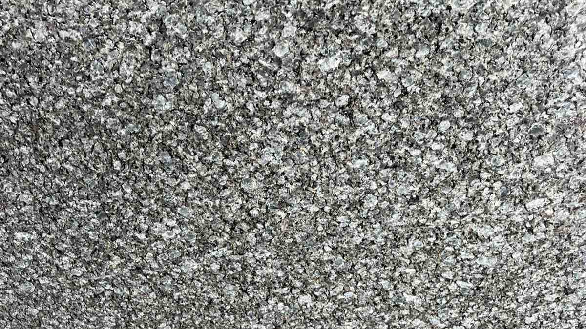 Premium Crystal Blue Indian Granite featuring a mesmerizing dance of crystalline blue hues. High-quality polished slab supplied wholesale in Kishangarh.