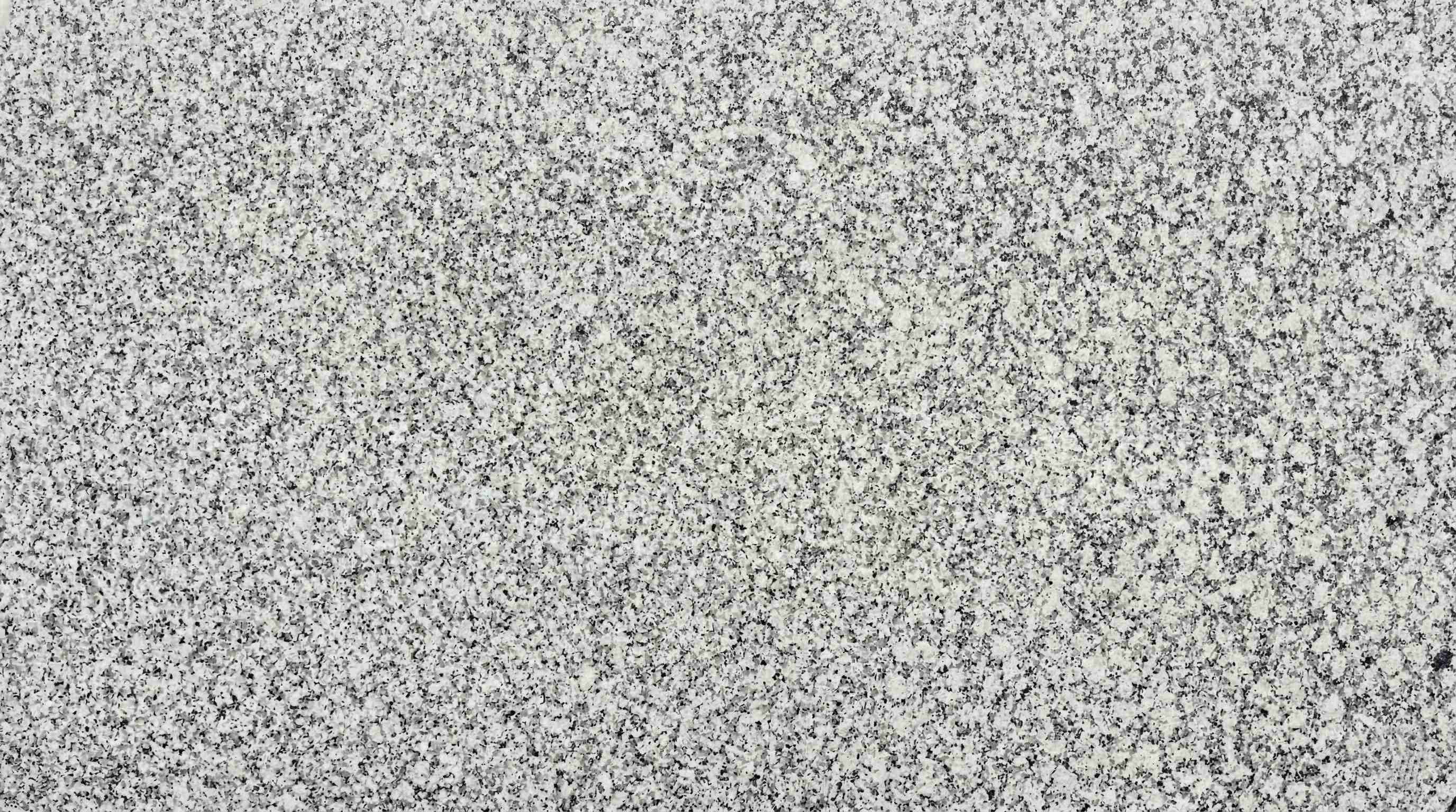 Premium P White Indian Granite featuring an unmatched pristine and bright white canvas. High-quality polished slab supplied wholesale in Kishangarh.